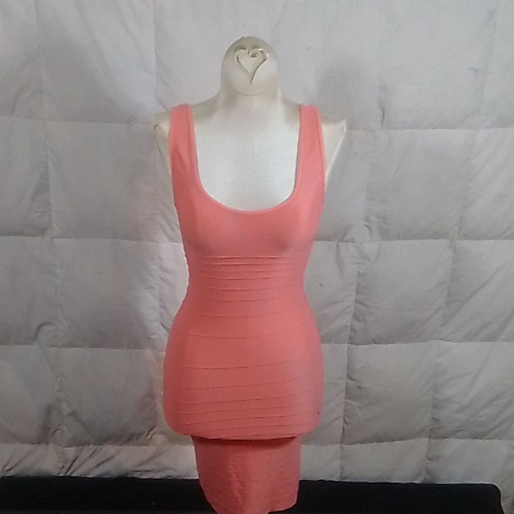 Low cut sleeveless backless sheath style dress by Bebe.
